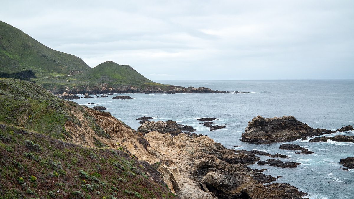 Steep green headlands and rocky shoreline along the Big Sur coast at Garrapata State Park